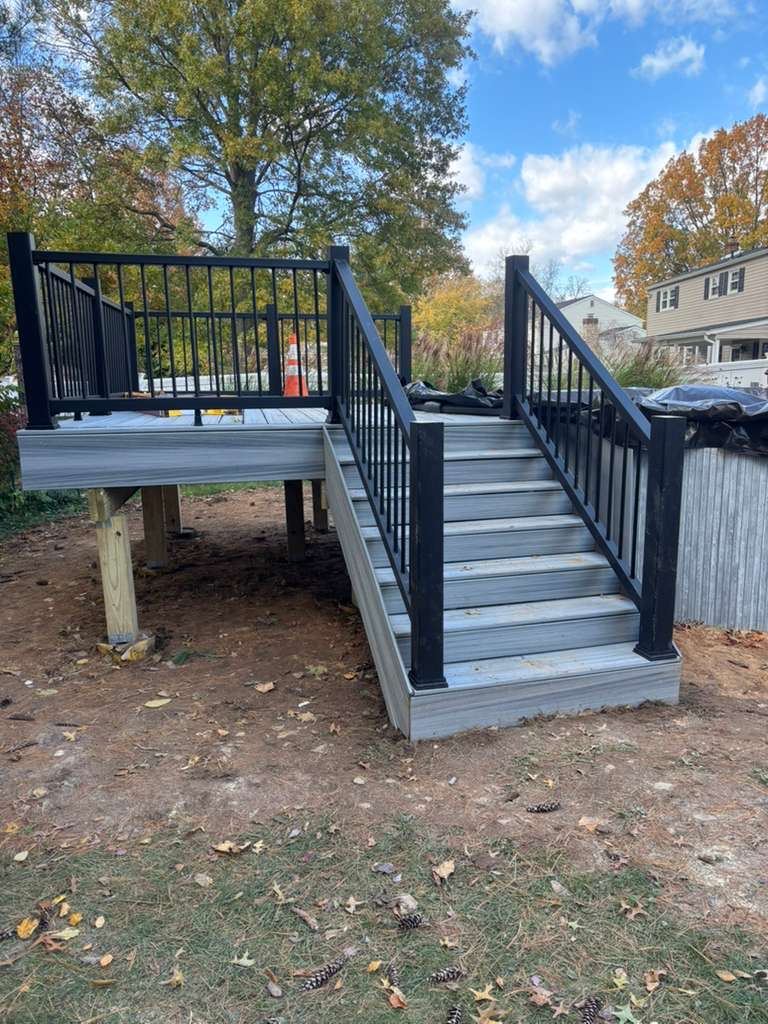 Gray composite deck with black railings and stairs